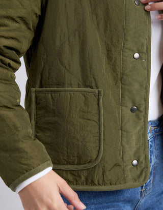 Olive green quilted lightweight jacket with corduroy trim and snap button closure.