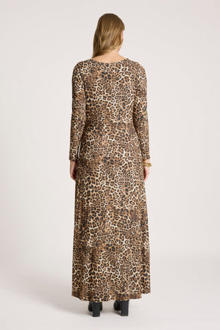 Back view of a woman wearing a long-sleeved leopard print maxi dress.