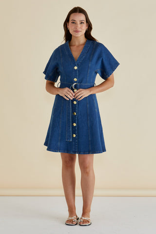 Woman wearing a blue denim short sleeve V-neck button-down dress with a waist belt.