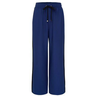 Women's royal blue wide leg lounge pants with black side stripes and drawstring waist