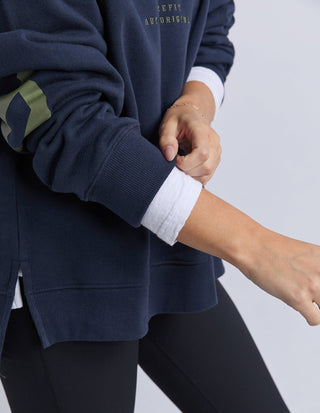 Side split hem detail on Foxwood Interval Hoodie in navy with khaki