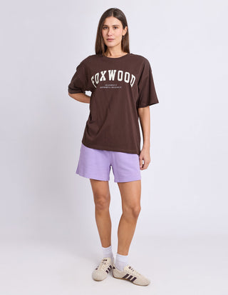 Close-up of cream Foxwood logo lettering on Coffee Bean cotton tee