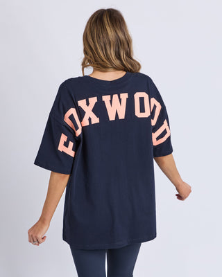 Foxwood Interval Tee in navy paired back with casual pants