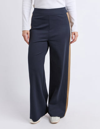 Navy blue wide leg palazzo pants with tan side stripe detail for women's leisure wear.