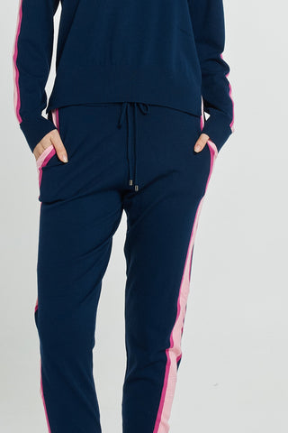 Navy blue knit leisure set with pink side stripes and drawstring waist