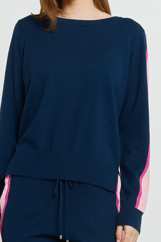 Navy blue long sleeve knit sweatshirt with pink side stripe detail.