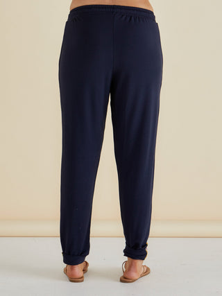 Navy blue women's leisure wear jogger pants with elastic waistband and cuffed ankles.