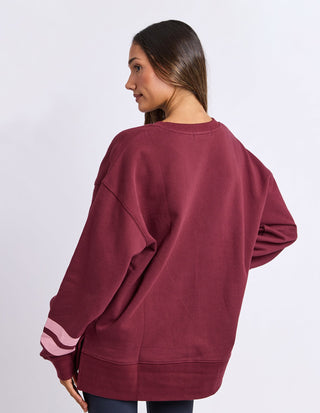 Close-up of Foxwood Origin Crew burgundy chest embroidery