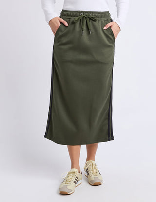 Woman wearing an olive green midi skirt with a drawstring waist and side stripes.