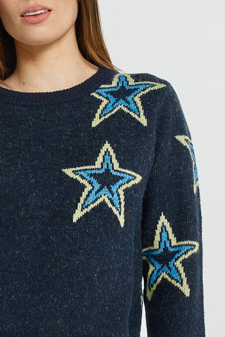 Navy blue knit sweatshirt featuring large light blue and cream star patterns.