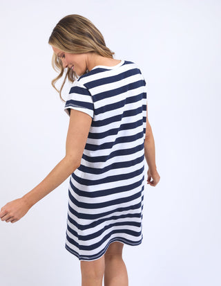 Woman wearing a navy and white striped short sleeve casual summer dress