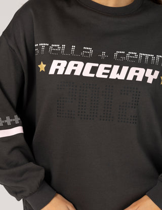 Black long sleeve sweatshirt featuring white and pink graphic racing typography.